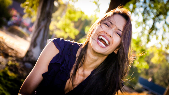 Joyful portrait of laughing girl outdoors in Walnut Creek