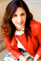 Whimsical portraits of a sassy woman in a red leather jacket outside the Presidio Library in San Francisco