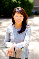 Outdoor portrait of woman in gray jacket at the Presidio Library in San Francisco.