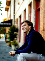 Authentic senior photos of young man in blue shirt in Sarasota FL
