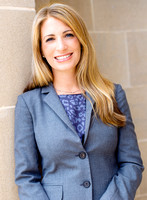 Headshot portraits of a blonde woman wearing a blue dress outside of the Presidio Library in San Francisco