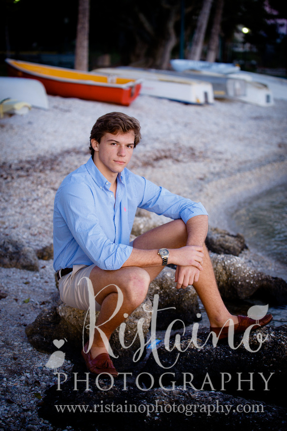 Authentic senior photos of young man in blue shirt in Sarasota FL